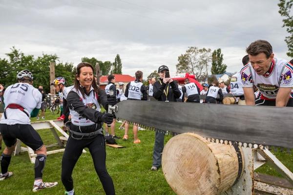 Layne Beachly competing in double-handed saw challenge.